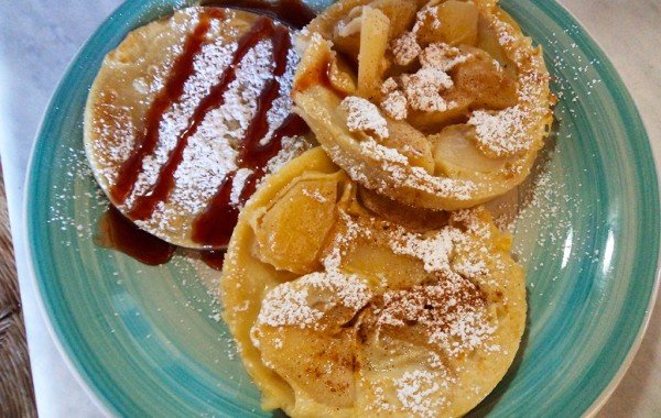 Pancakes with apple, sugar and honey